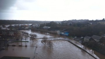 Minister of State engages with flood-affected homeowners during visit to Passage East in Co Waterford.