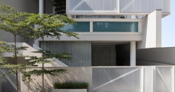 Innovative architectural design features flowing spaces and captivating staircase at residence_bb 214.