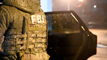FBI apprehends individuals involved in orchestrated robberies for immigration benefit applications.