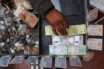 Rupee falls 11 paise to 94.27 against US dollar in early trade