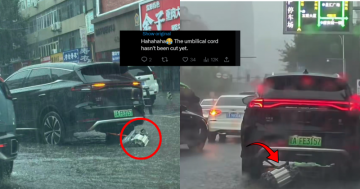 EV SUV Driving While Dragging Detached Motor Through Flooded Street