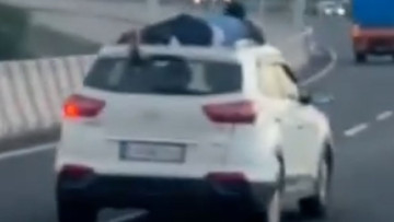 Singham Has Competition: Cop Clings to Getaway SUV for 25 Miles
