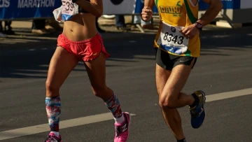 Fitness influencer celebrates marathon personal best, then photos emerge of her riding a bike during the race