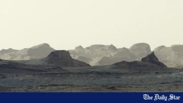 NASA's Curiosity rover captures stunning Martian dawn over ancient cliffs. The Red Planet Sunrise.