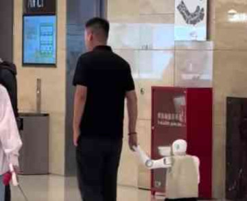 Man in Chengdu Spotted Walking a Child Sized Robot Like His Son! 🤖✨